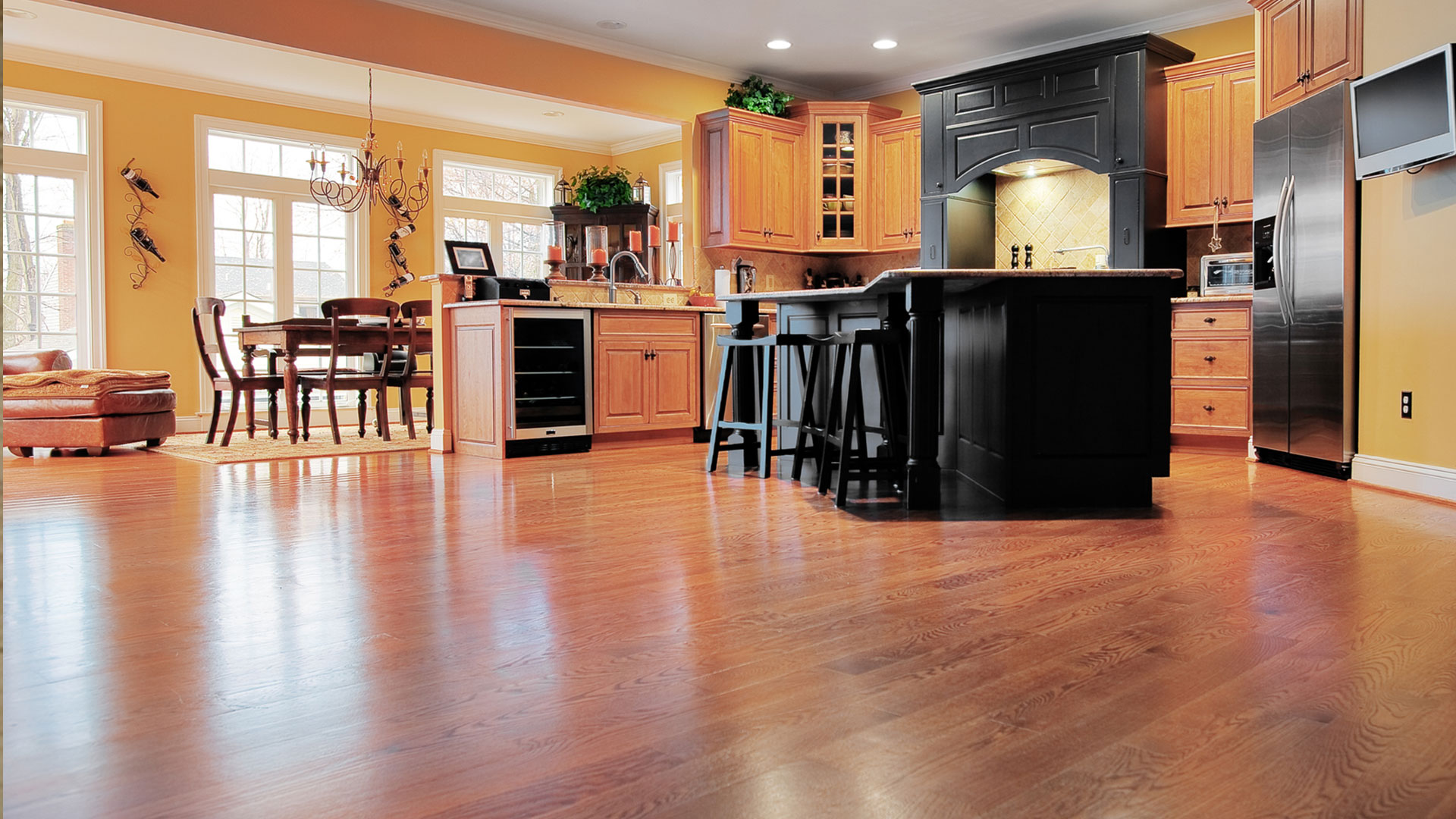 Modern kitchen interior with wooden cabinets and island.